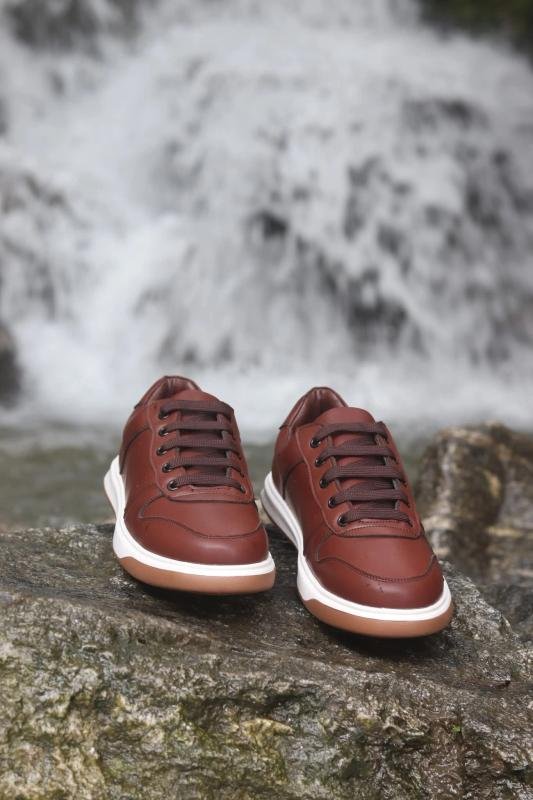 Royal Shoes sneaker product photography at waterfall